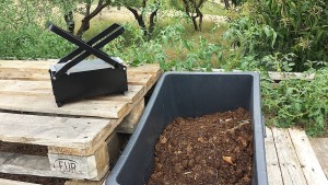 barrow of horse poo and briquette mould